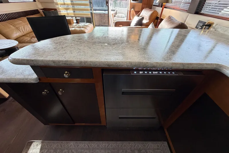  Yacht Photos Pics Luxurious interior of 2002 Carver 570 Voyager Pilothouse with modern kitchen design.