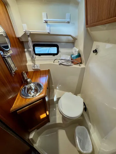  Yacht Photos Pics 2023 Ranger Tugs R-25 boat bathroom with sink, toilet, and window.