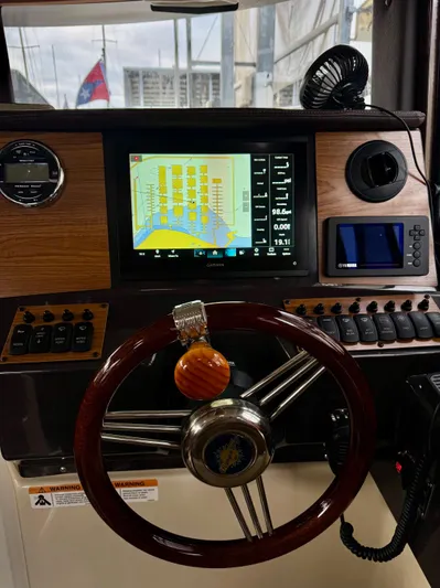  Yacht Photos Pics 2023 Ranger Tugs R-25 helm with navigation display and controls.