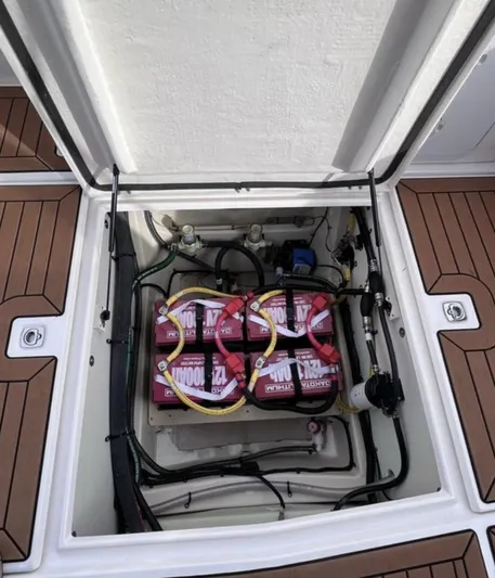  Yacht Photos Pics 2023 Ranger Tugs R-25 battery compartment with four batteries and wiring.
