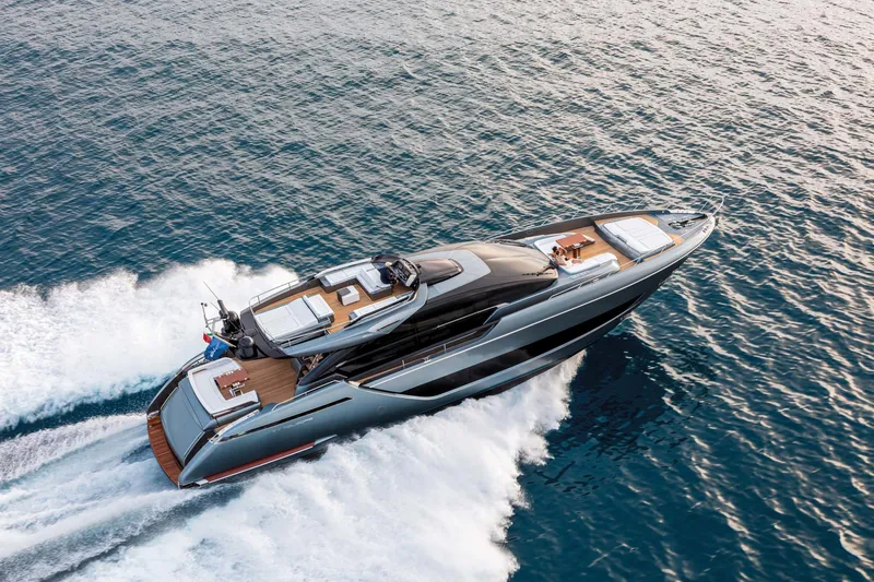  Yacht Photos Pics Luxurious 2025 Riva Folgore yacht cruising on open water.