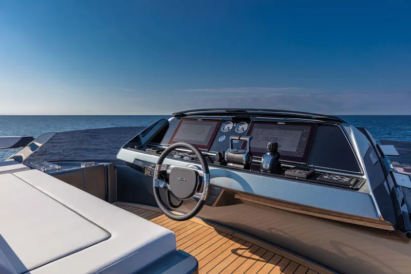  Yacht Photos Pics Helm of 2025 Riva Folgore yacht with ocean view and modern controls.