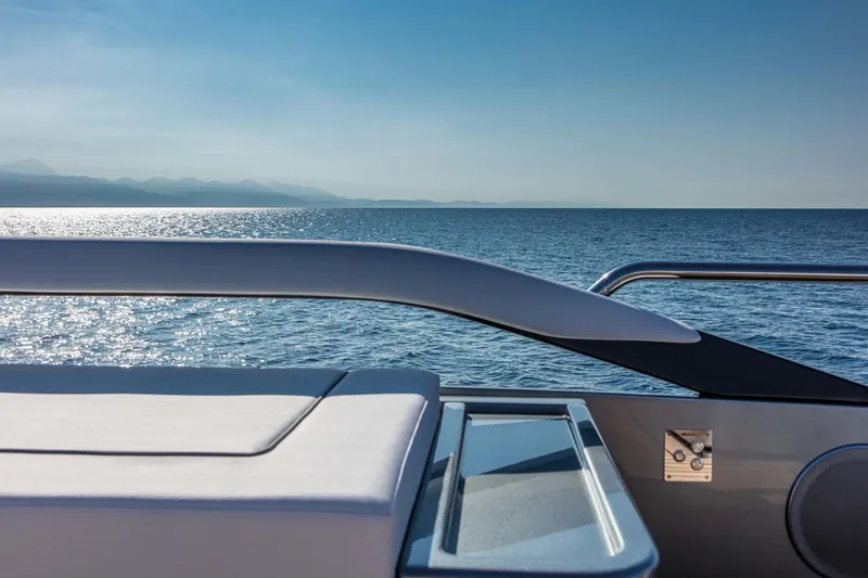  Yacht Photos Pics Luxury Riva Folgore 2025 yacht deck overlooking serene ocean view.