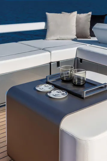  Yacht Photos Pics Luxurious 2025 Riva Folgore yacht deck with elegant seating and drinks setup.