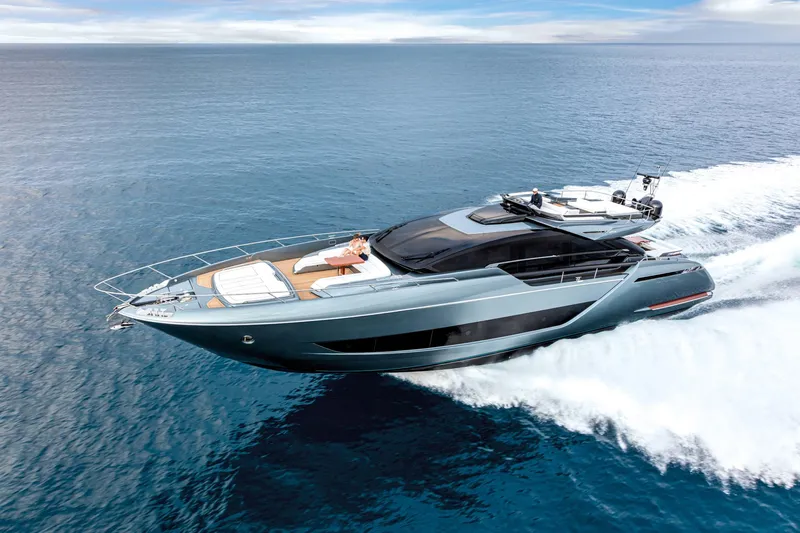  Yacht Photos Pics Luxury 2025 Riva Folgore yacht cruising on open sea, showcasing sleek design and elegance.
