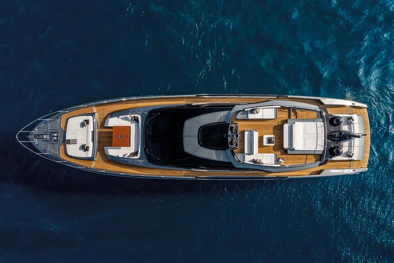  Yacht Photos Pics Aerial view of 2025 Riva Folgore yacht on deep blue water.