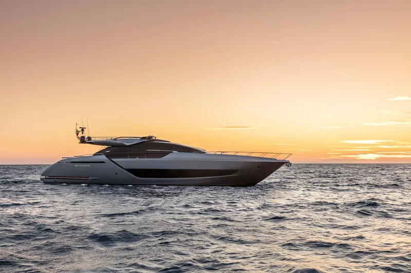  Yacht Photos Pics 2025 Riva Folgore yacht cruising at sunset on the open sea.