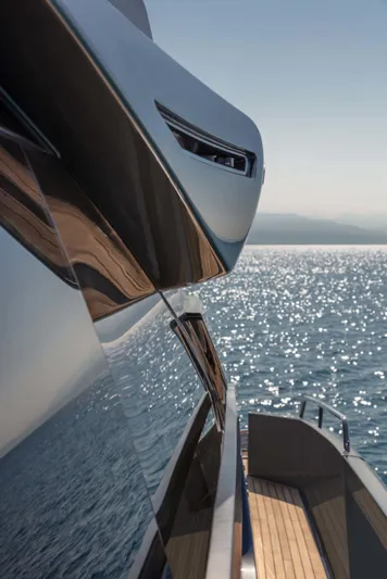  Yacht Photos Pics 2025 Riva Folgore yacht reflecting sunlight on the ocean.