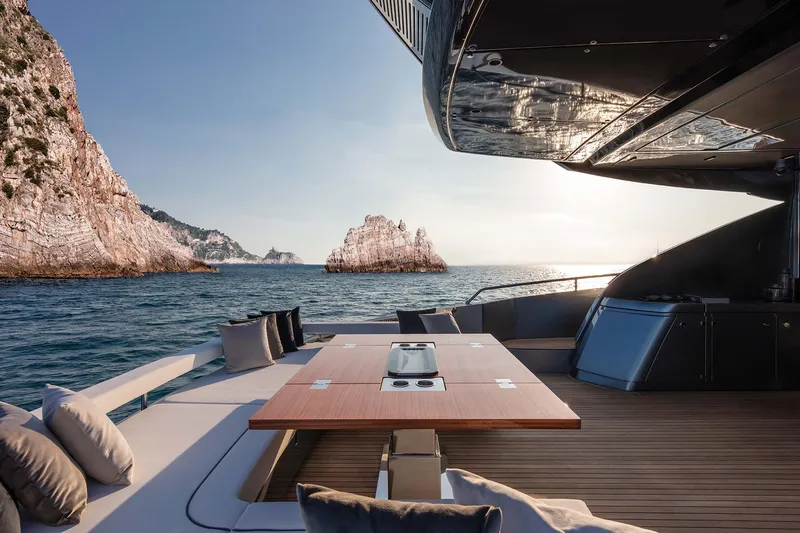 Yacht Photos Pics Luxurious 2025 Riva Folgore yacht deck with ocean view and elegant seating area.