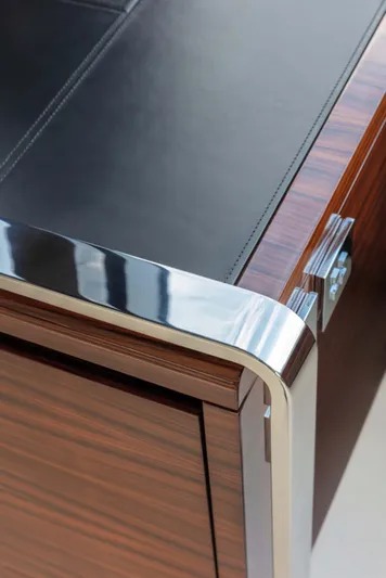  Yacht Photos Pics Close-up of 2025 Riva Folgore's sleek wood and chrome detailing.