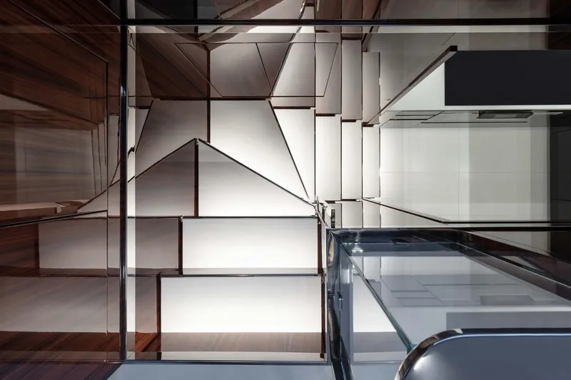  Yacht Photos Pics Modern interior design with geometric patterns and sleek surfaces in a 2025 Riva Folgore.