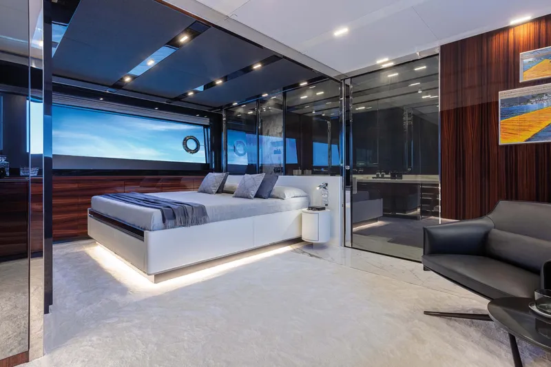  Yacht Photos Pics Luxurious bedroom interior of 2025 Riva Folgore yacht with modern design and elegant furnishings.