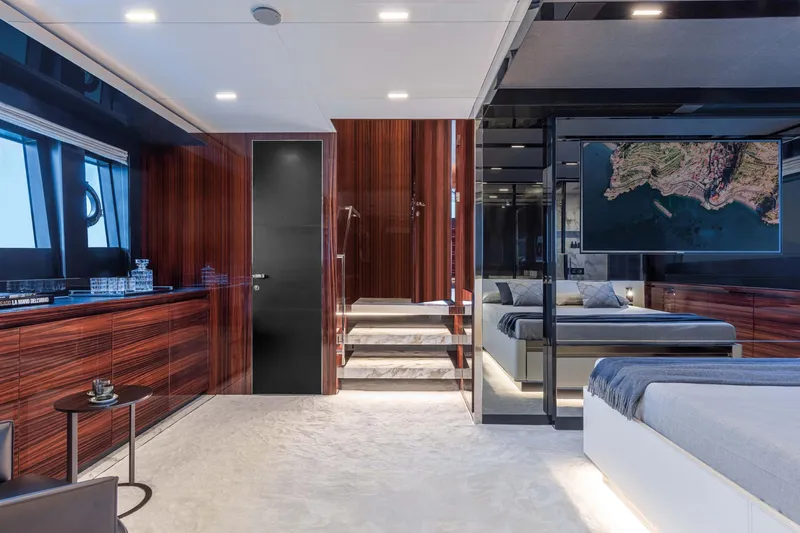  Yacht Photos Pics Luxurious interior of 2025 Riva Folgore yacht with modern design and elegant wood paneling.