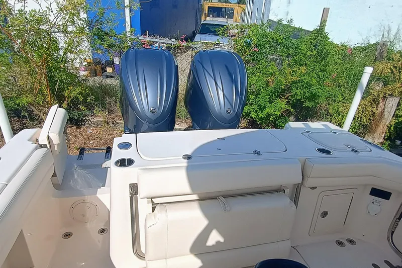 271-508 Brokerage Joe Yacht Photos Pics 2023 Grady-White Canyon 271 boat with dual outboard engines, docked outdoors.