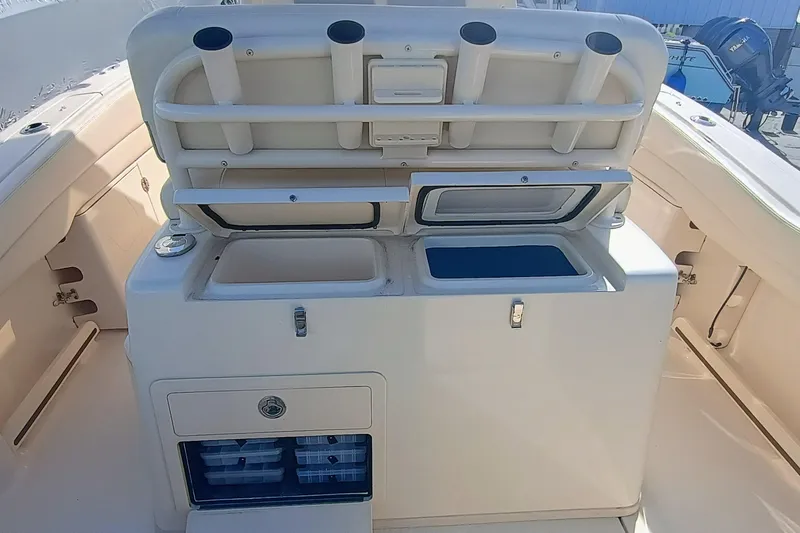 271-508 Brokerage Joe Yacht Photos Pics 2023 Grady-White Canyon 271 boat interior with storage compartments and rod holders.