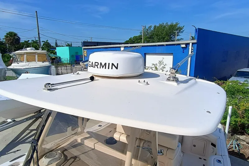 271-508 Brokerage Joe Yacht Photos Pics 2023 Grady-White Canyon 271 boat with Garmin radar, docked outdoors.