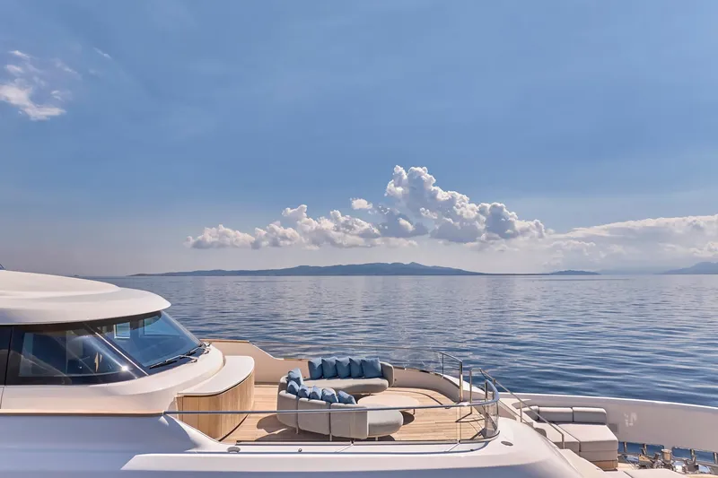 M/y K2 Yacht Photos Pics Luxurious 2024 Sanlorenzo SD118/156 yacht with elegant deck seating, cruising on serene waters.