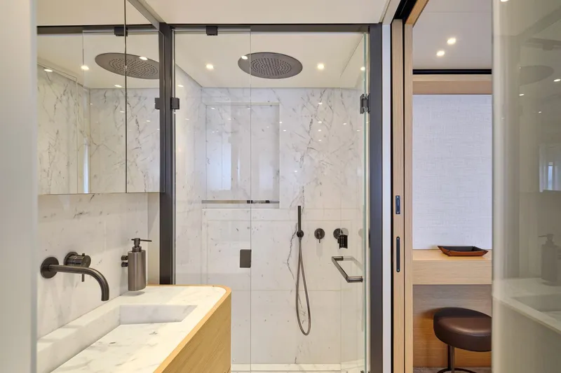 M/y K2 Yacht Photos Pics Luxurious marble bathroom in 2024 Sanlorenzo SD118/156 yacht, featuring modern fixtures and elegant design.