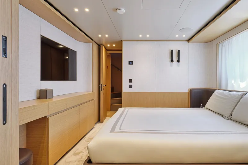 M/y K2 Yacht Photos Pics Luxurious bedroom interior of 2024 Sanlorenzo SD118/156 yacht with modern design and elegant furnishings.