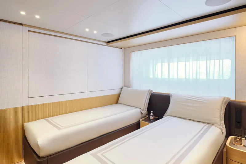 M/y K2 Yacht Photos Pics Luxurious twin cabin interior of 2024 Sanlorenzo SD118/156 yacht, featuring modern design and soft lighting.