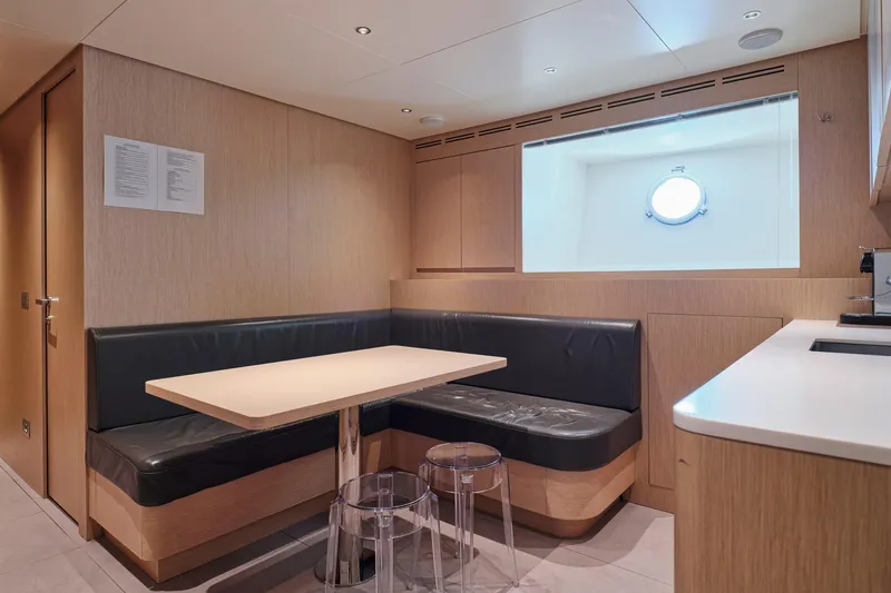 M/y K2 Yacht Photos Pics 2024 Sanlorenzo SD118/156 yacht interior with modern dining area and porthole window.