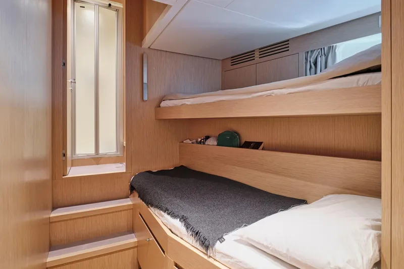 M/y K2 Yacht Photos Pics 2024 Sanlorenzo SD118/156 yacht cabin with bunk beds and modern wood finish.