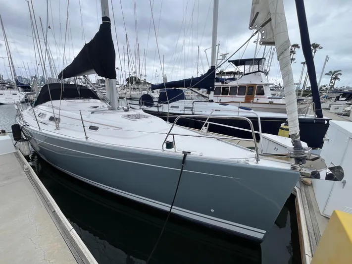 Dragonfly Yacht Photos Pics 2007 Hanse 370e sailboat docked at marina, featuring sleek design and modern rigging.