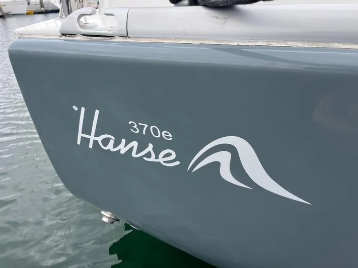 Dragonfly Yacht Photos Pics 2007 Hanse 370e sailboat logo on gray hull at marina.