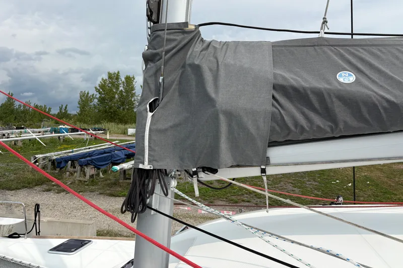 Too Impulsive Yacht Photos Pics Lagoon 380 S2 sailboat mast and rigging, 2014 model, with gray sail cover.