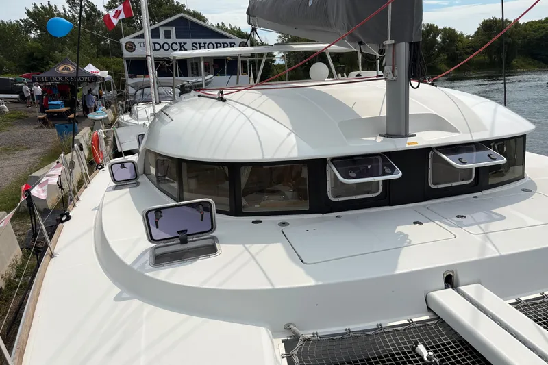 Too Impulsive Yacht Photos Pics 2014 Lagoon 380 S2 catamaran docked near The Dock Shoppe with open hatches.