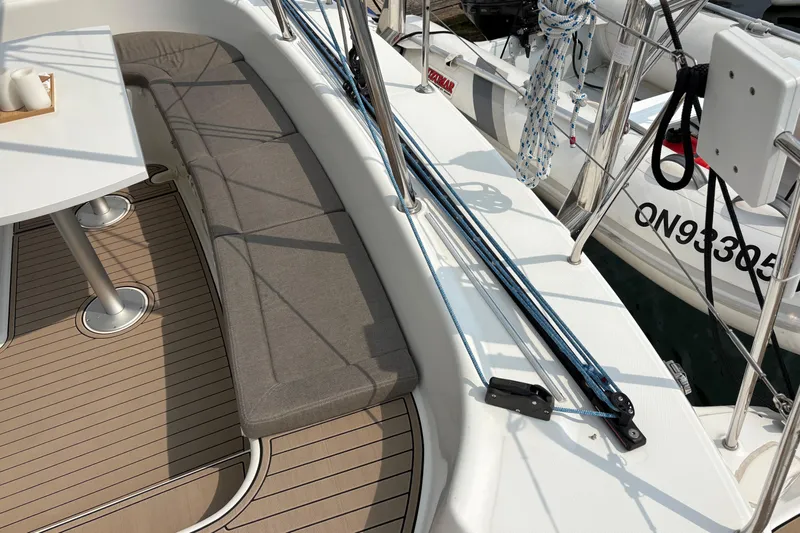 Too Impulsive Yacht Photos Pics Lagoon 380 S2 2014 yacht deck with seating and table, featuring nautical ropes.