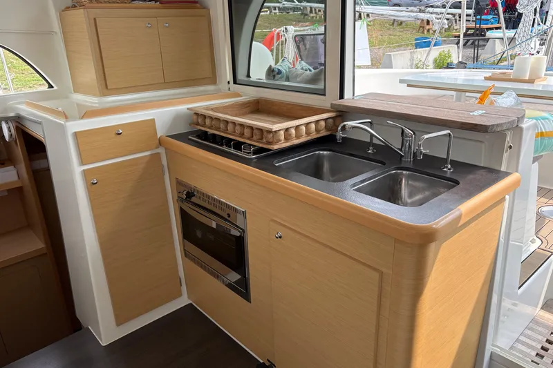 Too Impulsive Yacht Photos Pics Modern kitchen in 2014 Lagoon 380 S2 catamaran with dual sinks and oven.
