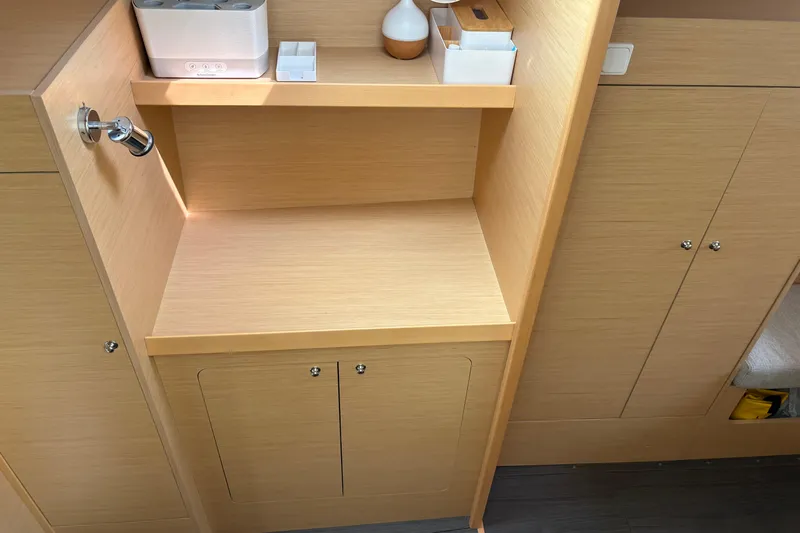 Too Impulsive Yacht Photos Pics Interior of 2014 Lagoon 380 S2 yacht with wooden cabinetry and storage space.