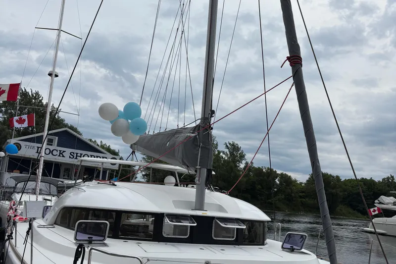 Too Impulsive Yacht Photos Pics 2014 Lagoon 380 S2 catamaran docked with balloons and Canadian flags.
