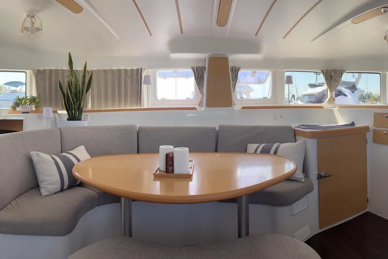 Too Impulsive Yacht Photos Pics Interior of 2014 Lagoon 380 S2 catamaran with cozy seating and modern decor.