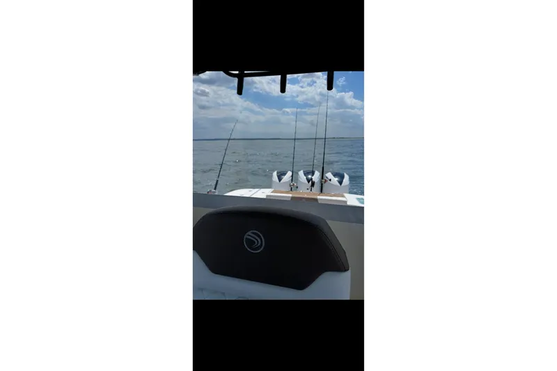  Yacht Photos Pics 2017 Edgewater 368CC boat with fishing rods on open water.