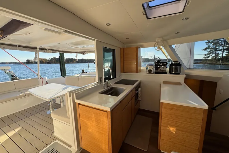Hokule'a Yacht Photos Pics Modern kitchen on 2024 Balance 482 yacht with scenic water view.