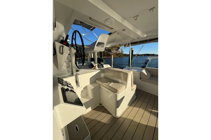 Hokule'a Yacht Photos Pics Interior of 2024 Balance 482 yacht, featuring modern helm and seating with ocean view.