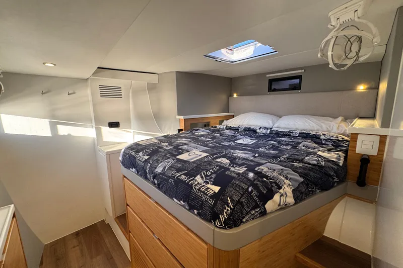 Hokule'a Yacht Photos Pics Modern bedroom interior in 2024 Balance 482 yacht with skylight and stylish bedding.