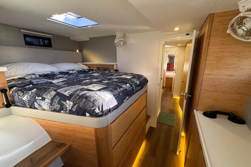 Hokule'a Yacht Photos Pics Luxurious cabin interior of 2024 Balance 482 yacht with modern bedding and wood accents.