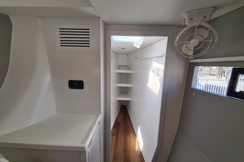 Hokule'a Yacht Photos Pics 2024 Balance 482 yacht interior with modern design, featuring shelves and a fan.