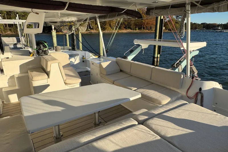 Hokule'a Yacht Photos Pics Luxurious 2024 Balance 482 yacht interior with comfortable seating and scenic waterfront view.