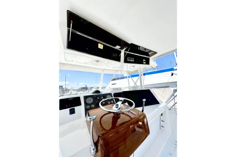 Marlin Magic Yacht Photos Pics 1999 Viking 43 Convertible yacht helm with polished wood and modern controls.