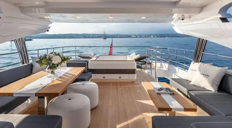  Yacht Photos Pics Luxurious Pearl 95 yacht interior, featuring elegant seating and ocean views, 2025 model.