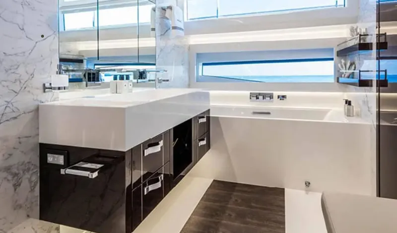 Yacht Photos Pics Luxurious bathroom interior on 2025 Pearl 95 yacht, featuring modern fixtures and marble accents.