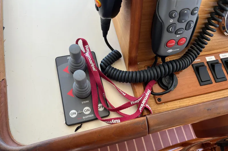  Yacht Photos Pics Control panel of a 2005 Mainship 400 Trawler with joysticks and communication devices.