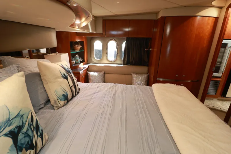 Nauti Buoy Yacht Photos Pics Luxurious 2007 Cruisers 520 Express yacht bedroom with elegant decor and cozy bedding.