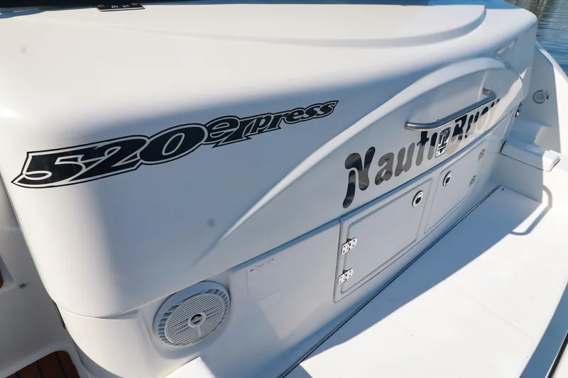 Nauti Buoy Yacht Photos Pics 2007 Cruisers 520 Express boat deck with branding and storage compartments.