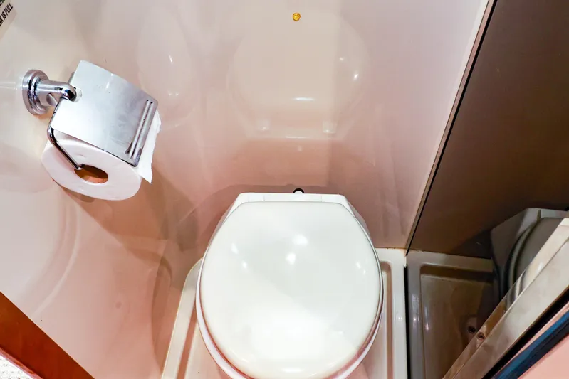 Nauti Buoy Yacht Photos Pics 2007 Cruisers 520 Express yacht bathroom with toilet and toilet paper holder.