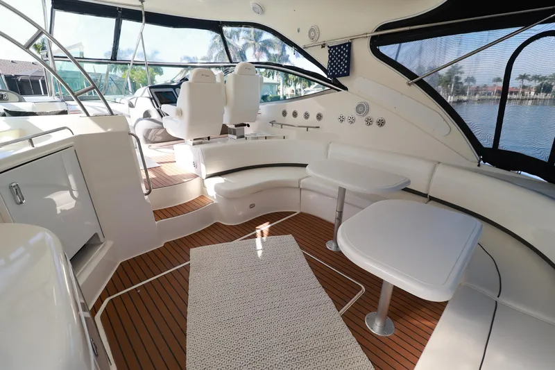 Nauti Buoy Yacht Photos Pics Luxurious 2007 Cruisers 520 Express yacht interior with seating and tables.